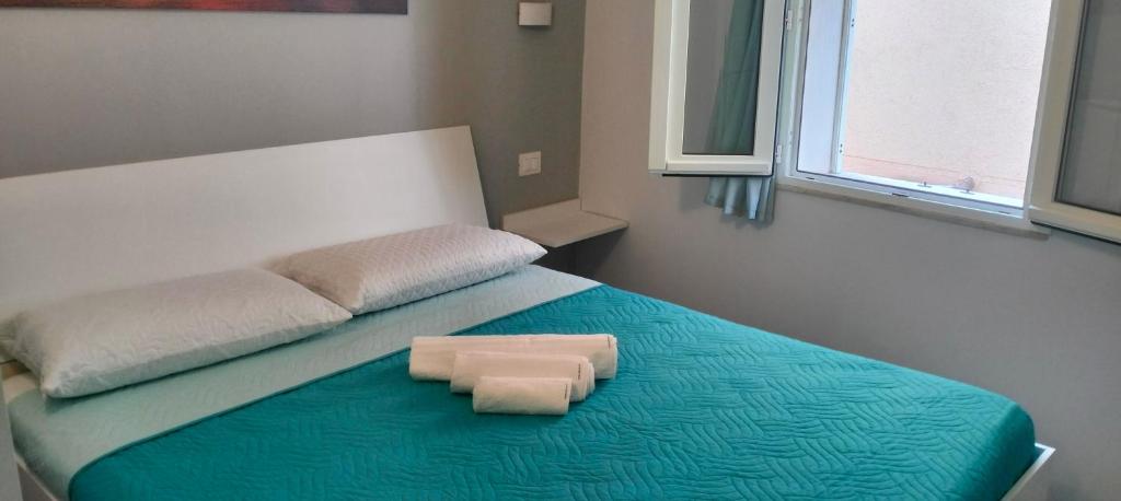 Postel nebo postele na pokoji v ubytování Le vie del centro