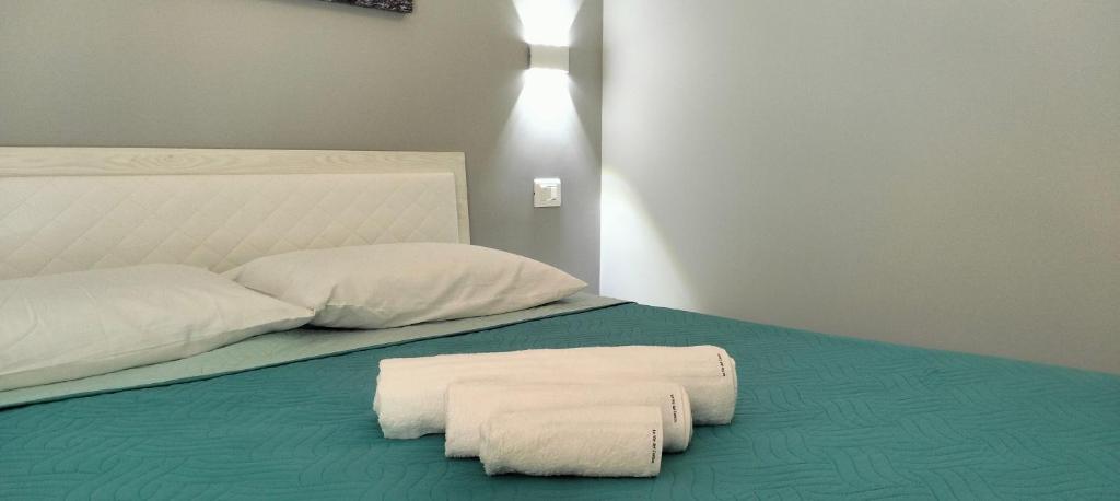 Postel nebo postele na pokoji v ubytování Le vie del centro