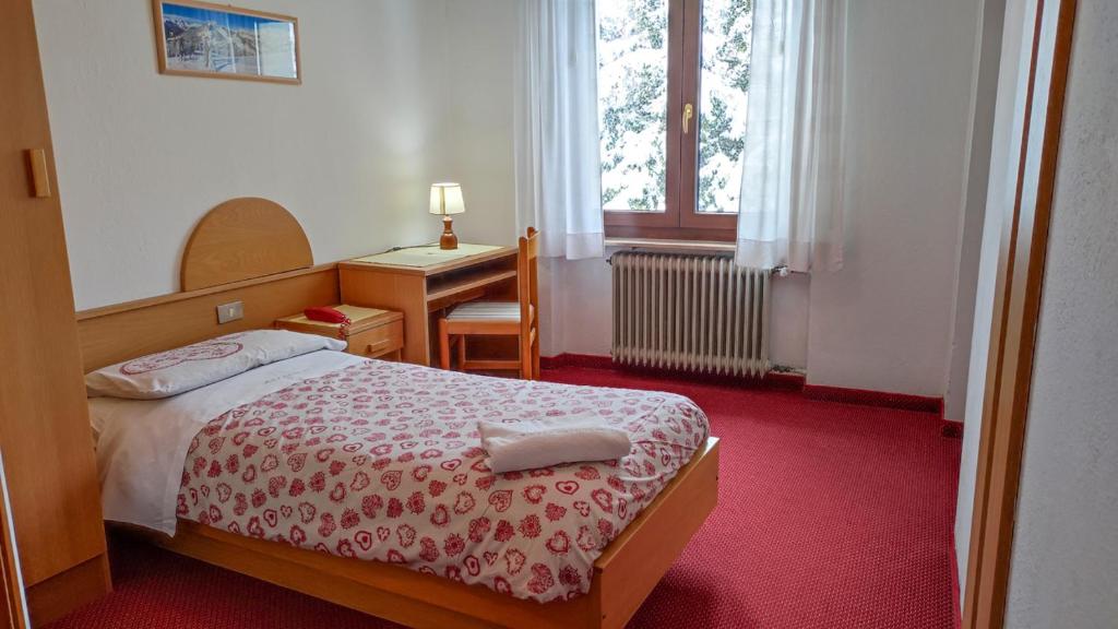 Postel nebo postele na pokoji v ubytování Hotel Edelweiss