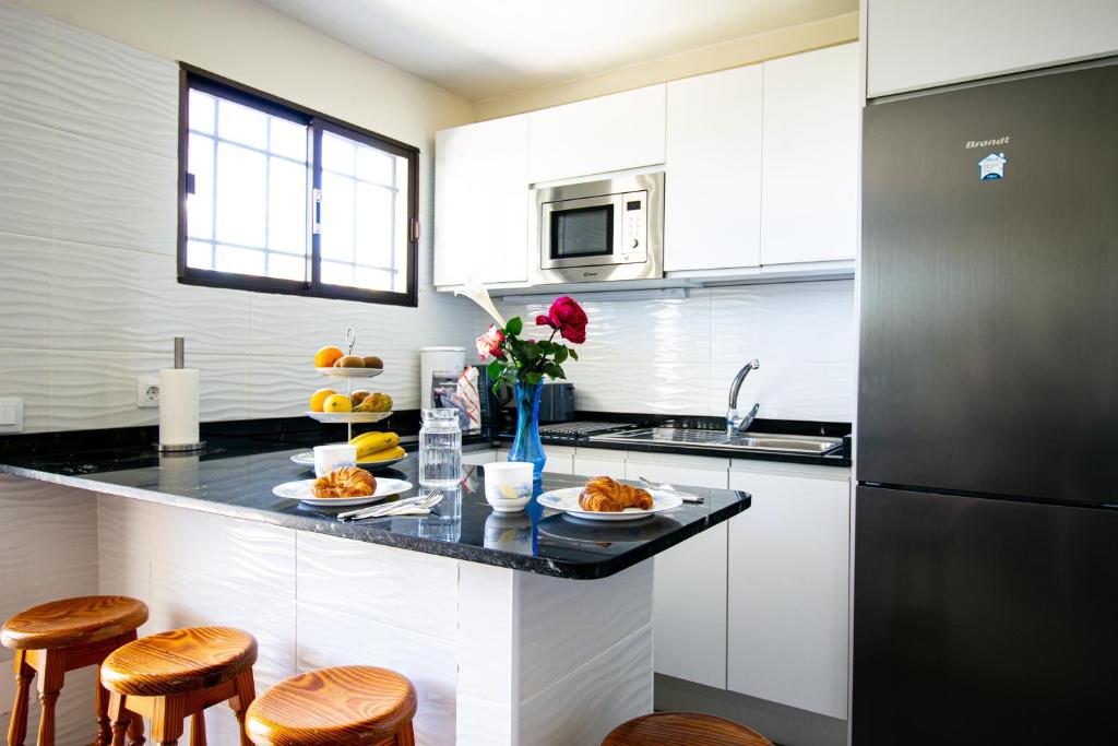 Kuchyň nebo kuchyňský kout v ubytování Apartamento en Las Flores I