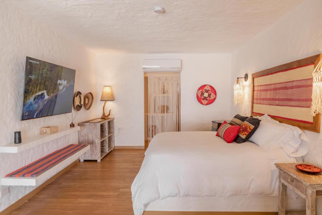 Postel nebo postele na pokoji v ubytování Bora Bora Beach Club & Hotel