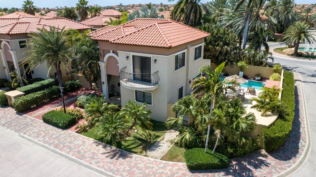 an aerial view of a house with palm trees at Diamante 165 Luxury Villa with Private Pool in Gold Coast 3 Bedrooms 3 Bath in Palm-Eagle Beach