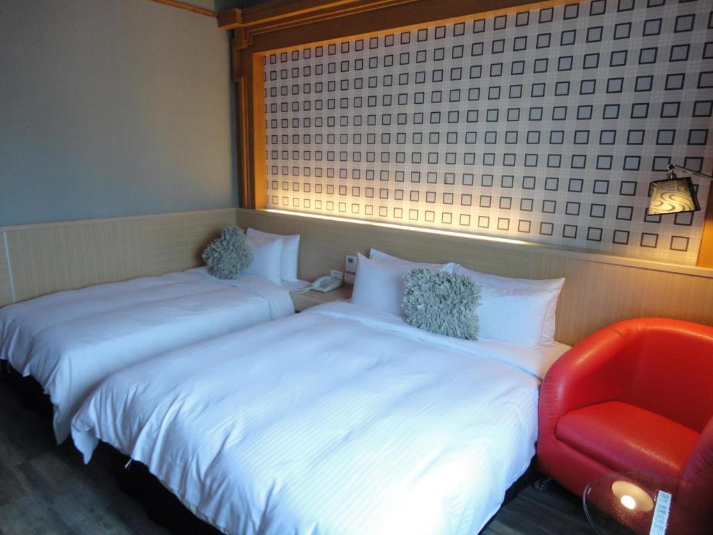 Postel nebo postele na pokoji v ubytování Royal Hotel