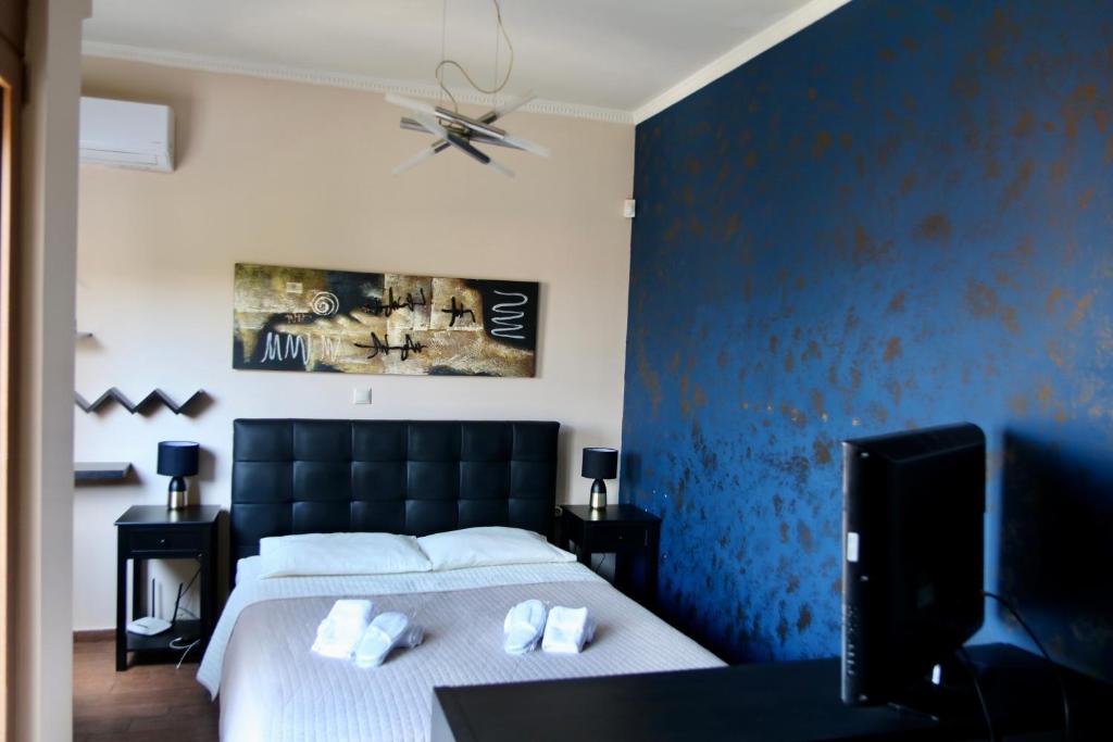 Postel nebo postele na pokoji v ubytování Villa Ariadne