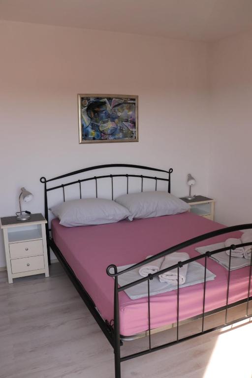 Posteľ alebo postele v izbe v ubytovaní Apartments Loris