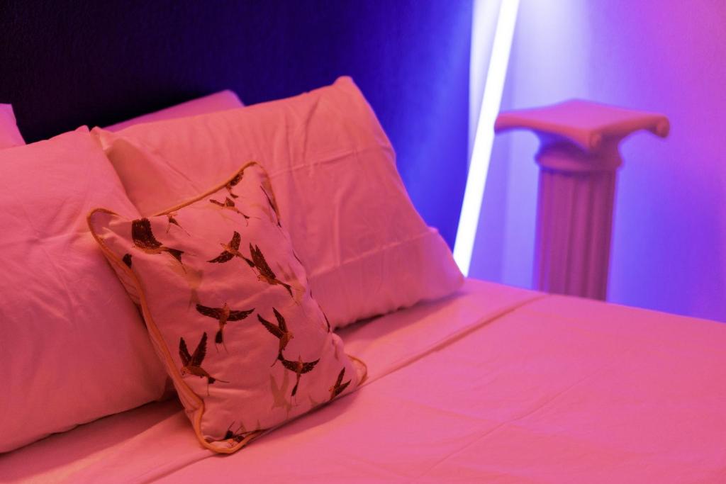 Posteľ alebo postele v izbe v ubytovaní Roma Reva: design et home cinema