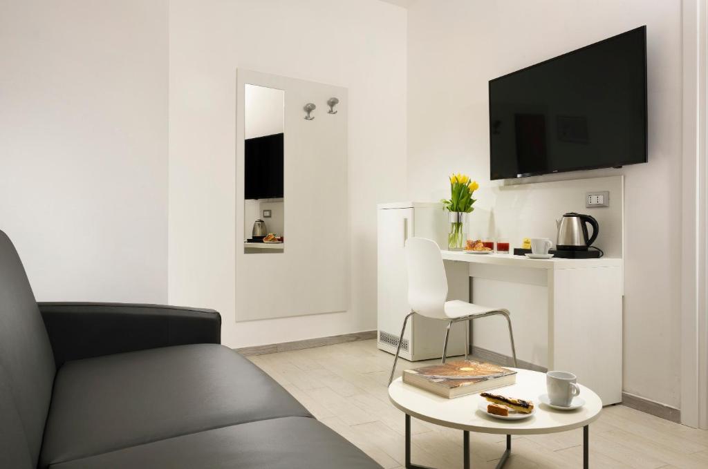 TV a/nebo společenská místnost v ubytování Hotel Patria
