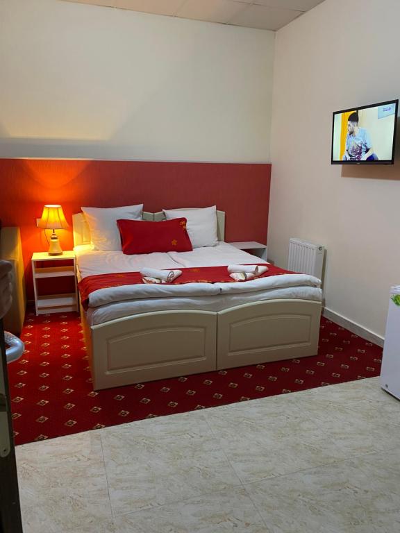 Postel nebo postele na pokoji v ubytování Lind Hotel and Guest House