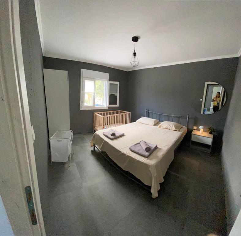 Postel nebo postele na pokoji v ubytování MK Residences