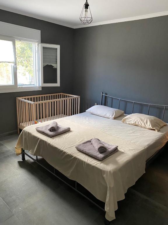 Postel nebo postele na pokoji v ubytování MK Residences