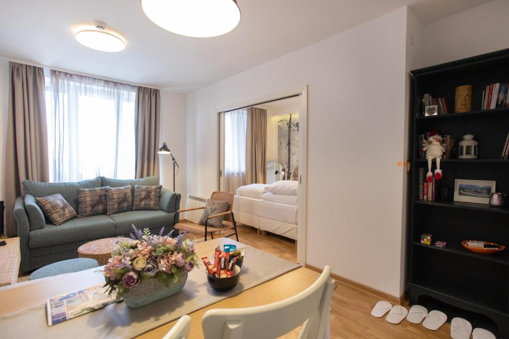 a living room with a couch and a table at Cardak u Sumi (Forest house) in Kopaonik