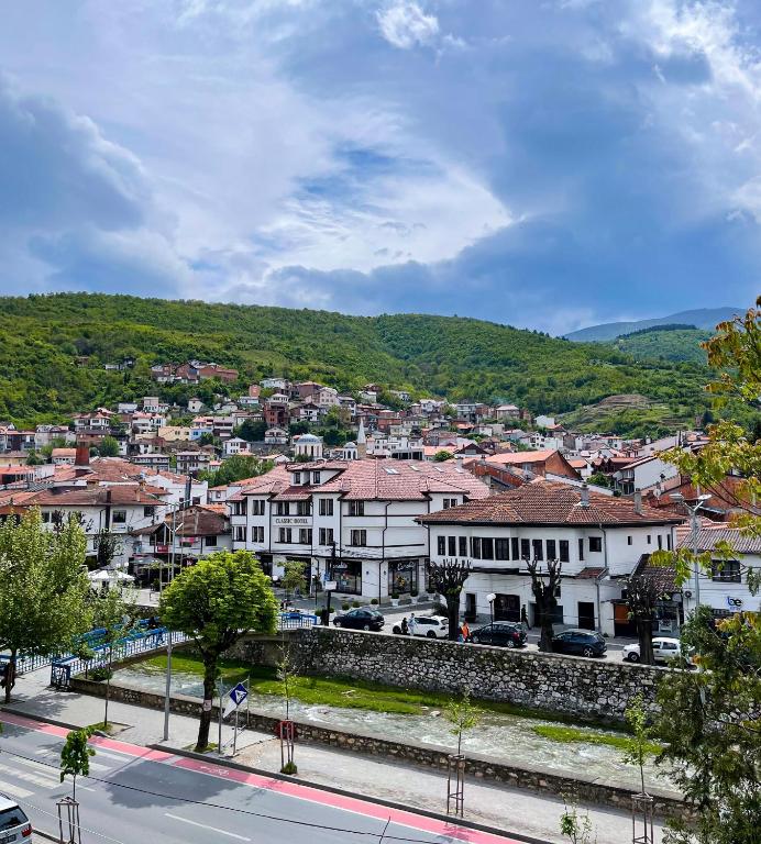 a view of a city with buildings and trees at Fellas Apartments in Prizren