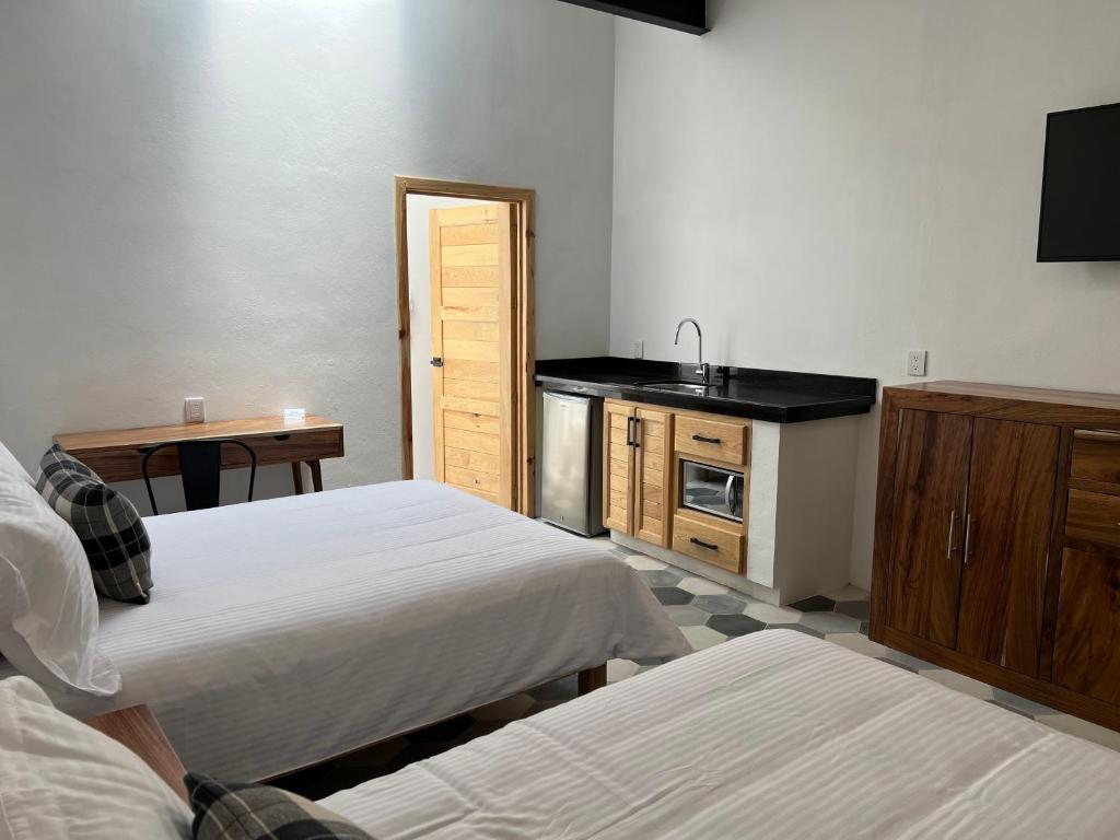 Postel nebo postele na pokoji v ubytování Hostal de la Montaña