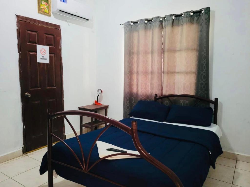 Postel nebo postele na pokoji v ubytování Hostal Rudy's Beach
