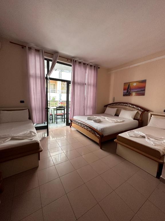 Postel nebo postele na pokoji v ubytování Seashell Beach Rooms