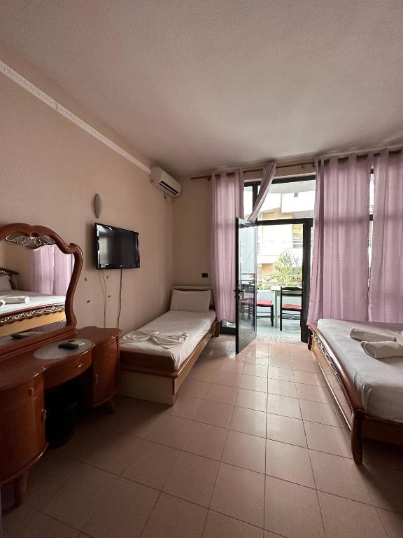 Postel nebo postele na pokoji v ubytování Seashell Beach Rooms