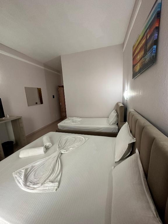 Postel nebo postele na pokoji v ubytování Seashell Beach Rooms