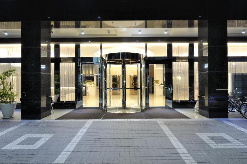 a lobby with a revolving door in a building at Guanko Hotel in Chiayi City