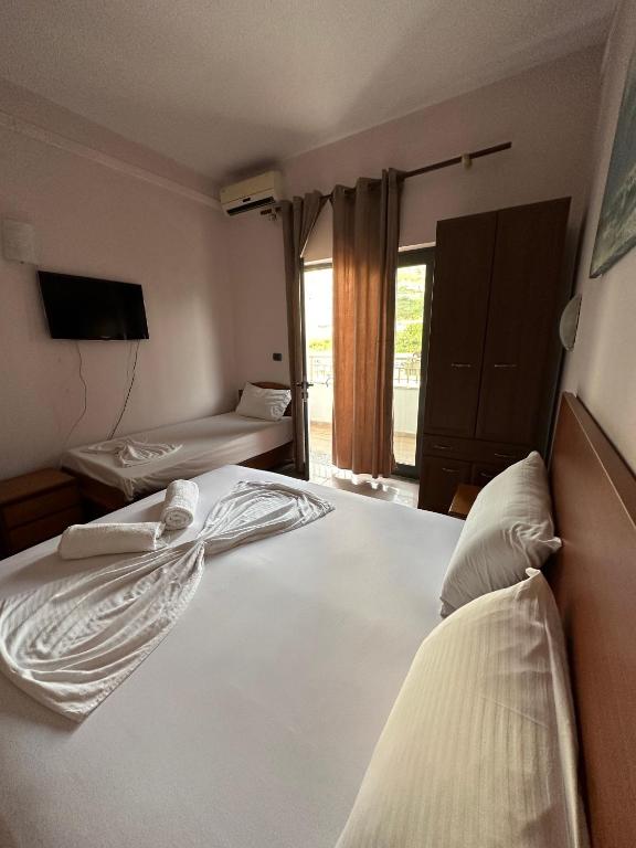 Postel nebo postele na pokoji v ubytování Seashell Beach Rooms
