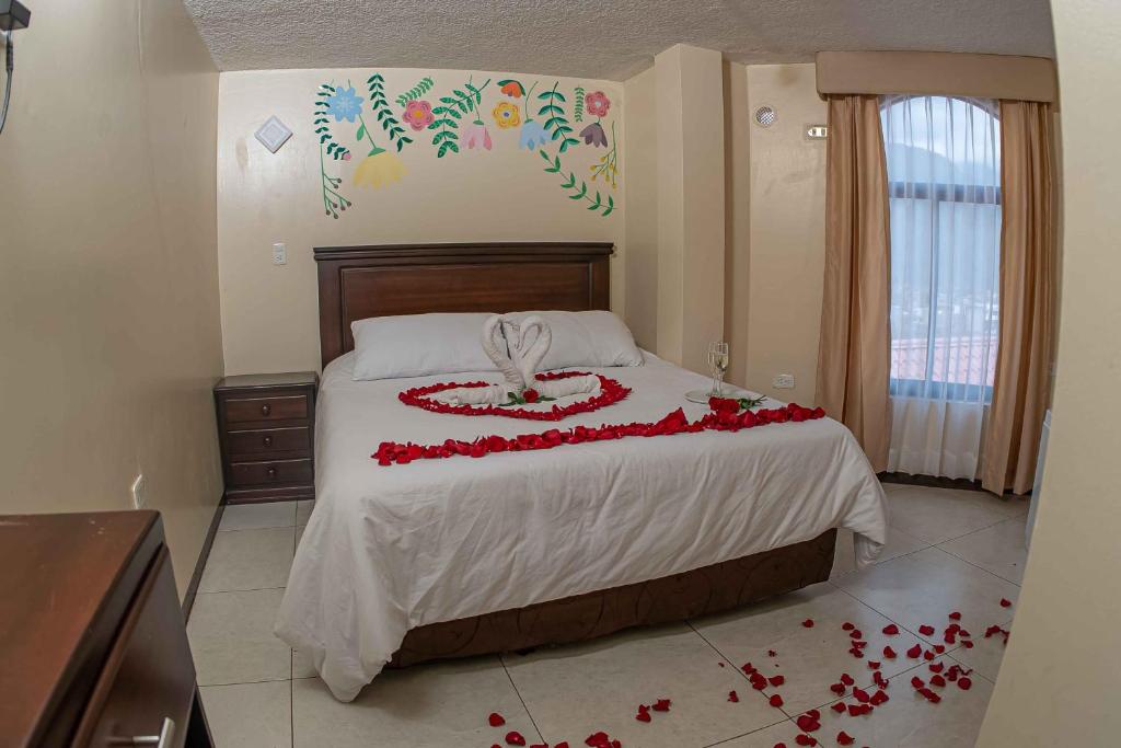 Postel nebo postele na pokoji v ubytování Hotel Tungurahua