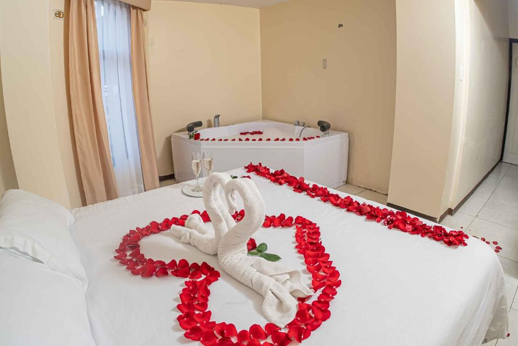 Postel nebo postele na pokoji v ubytování Hotel Tungurahua