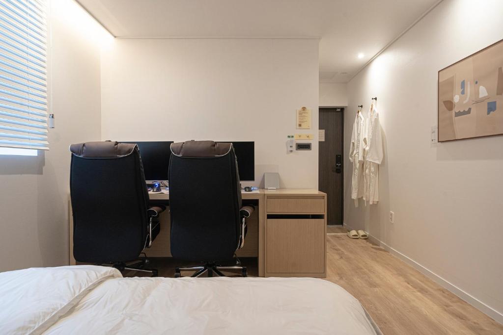 Postel nebo postele na pokoji v ubytování Aank Hotel Daejeon Yuseong 2nd