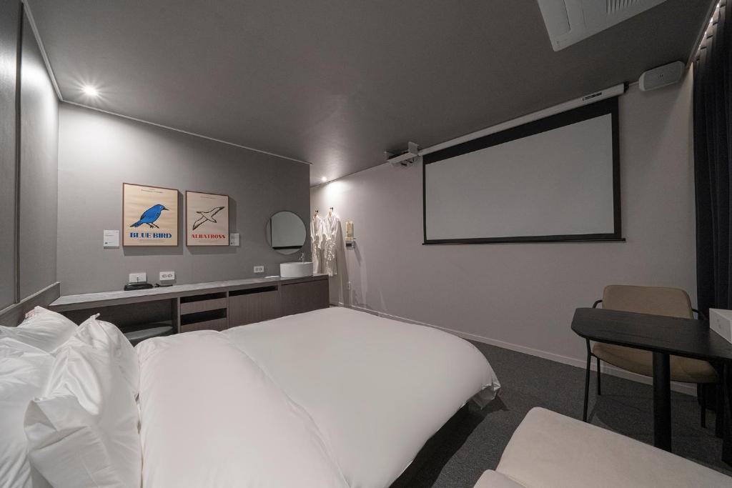 Postel nebo postele na pokoji v ubytování Aank Hotel Daejeon Yuseong 2nd