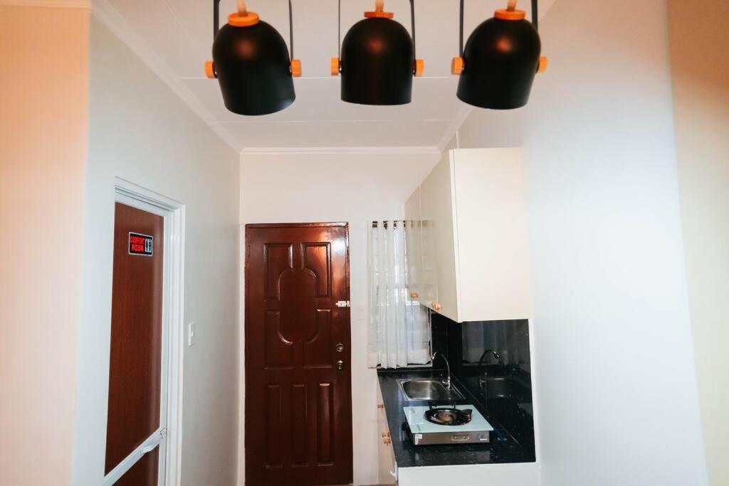 Kuchyň nebo kuchyňský kout v ubytování Cozy BNB - Unit L
