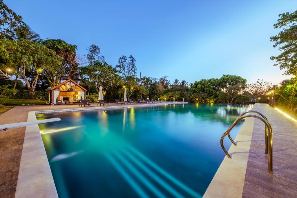 a swimming pool in a park at night at Pintoresco in Anuling