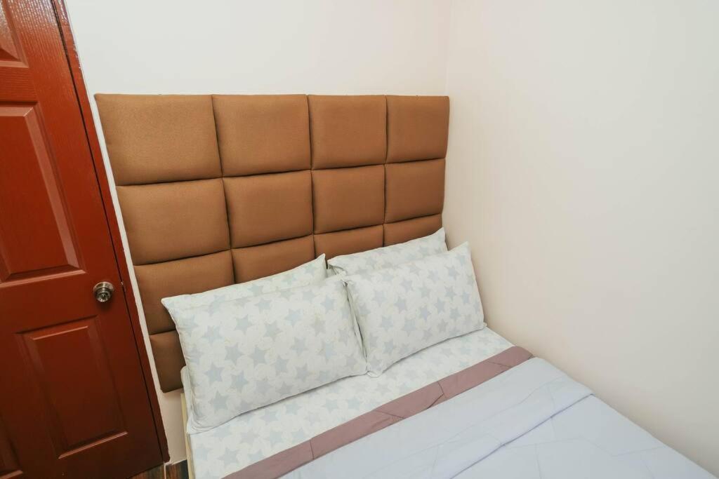 Postel nebo postele na pokoji v ubytování Cozy BNB - Unit G