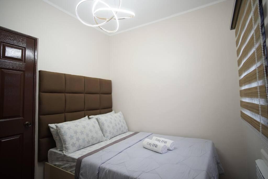 Postel nebo postele na pokoji v ubytování Cozy BNB - Unit G