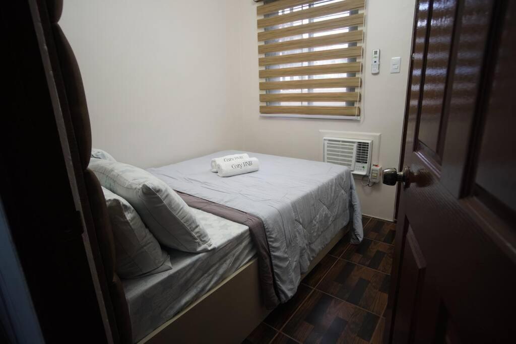 Postel nebo postele na pokoji v ubytování Cozy BNB - Unit G