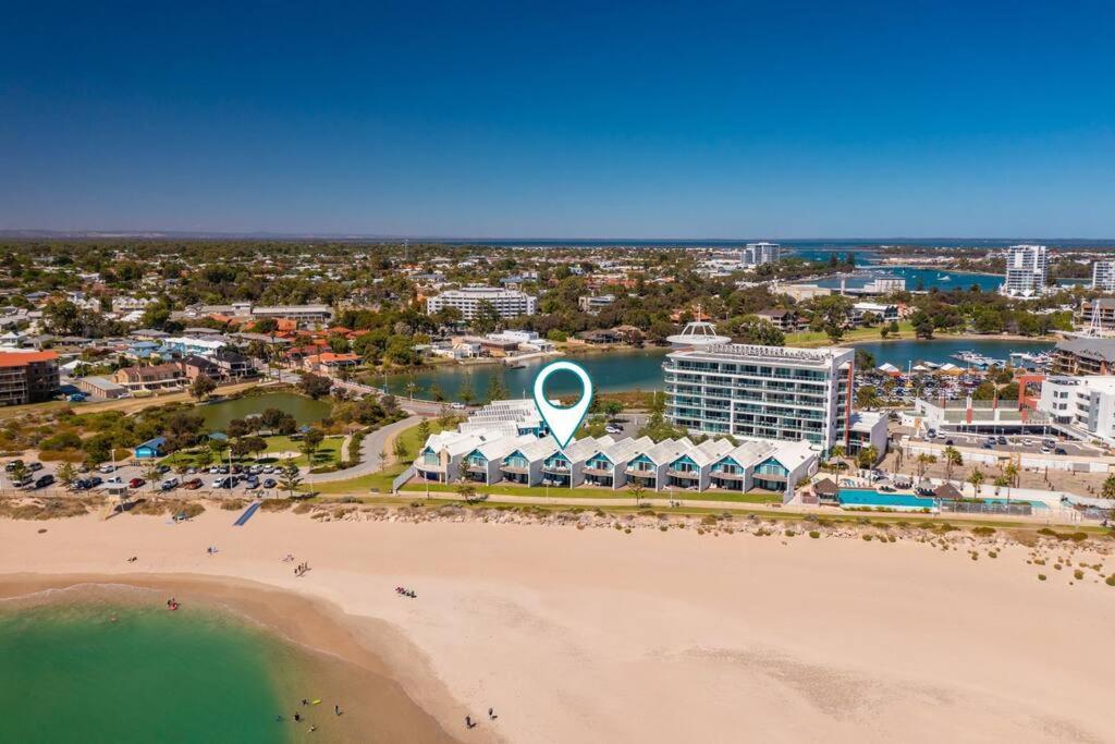 an aerial view of a beach in front of a resort at Ocean View Villa, 2 bedroom in Mandurah