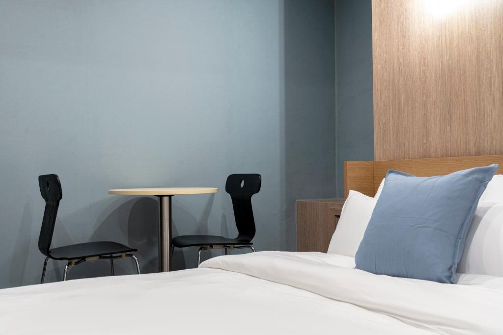 Postel nebo postele na pokoji v ubytování Shourin Hotel Daejeon by Aank