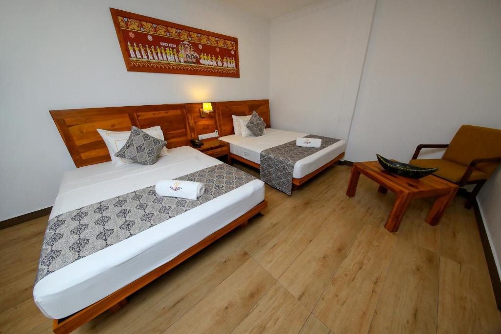 Postel nebo postele na pokoji v ubytování BPR - Asgiriya ,Kandy