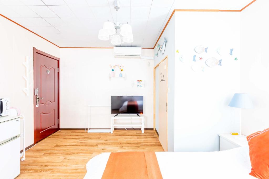 TV a/nebo společenská místnost v ubytování Senjoarashi