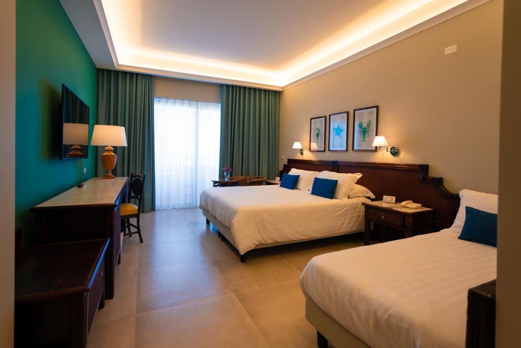 Łóżko lub łóżka w pokoju w obiekcie Hotel Schuhmann