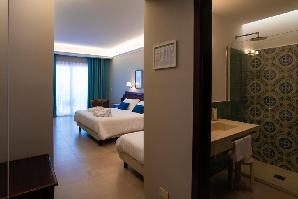 Łóżko lub łóżka w pokoju w obiekcie Hotel Schuhmann