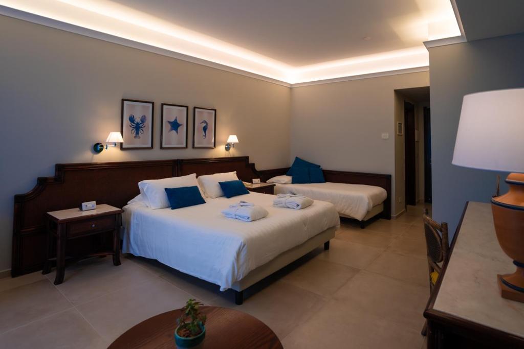 Łóżko lub łóżka w pokoju w obiekcie Hotel Schuhmann