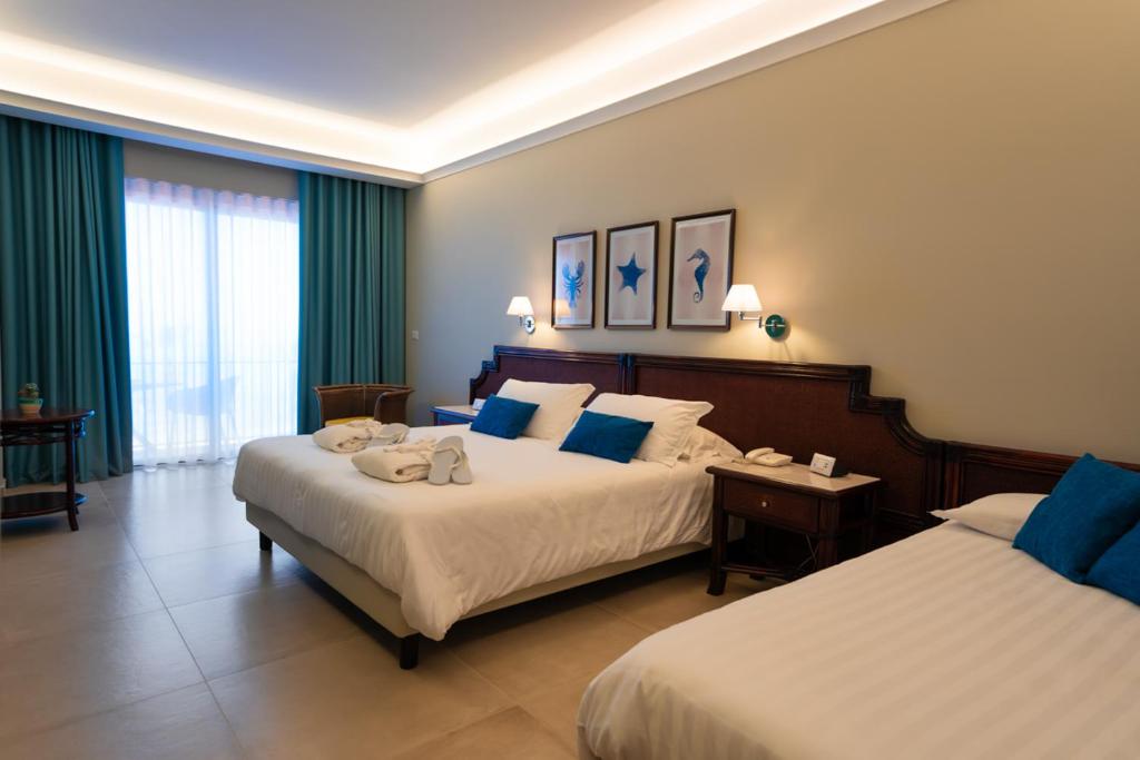 Łóżko lub łóżka w pokoju w obiekcie Hotel Schuhmann