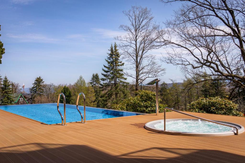 Bazén v ubytovaní Green Park Resort C15- z dostępem do basenu, sauny, jacuzzi, siłowni alebo v jeho blízkosti