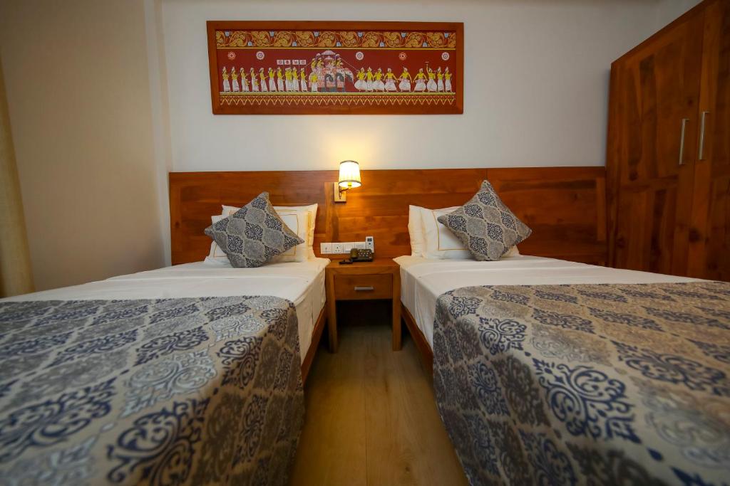 Postel nebo postele na pokoji v ubytování BPR - Asgiriya ,Kandy