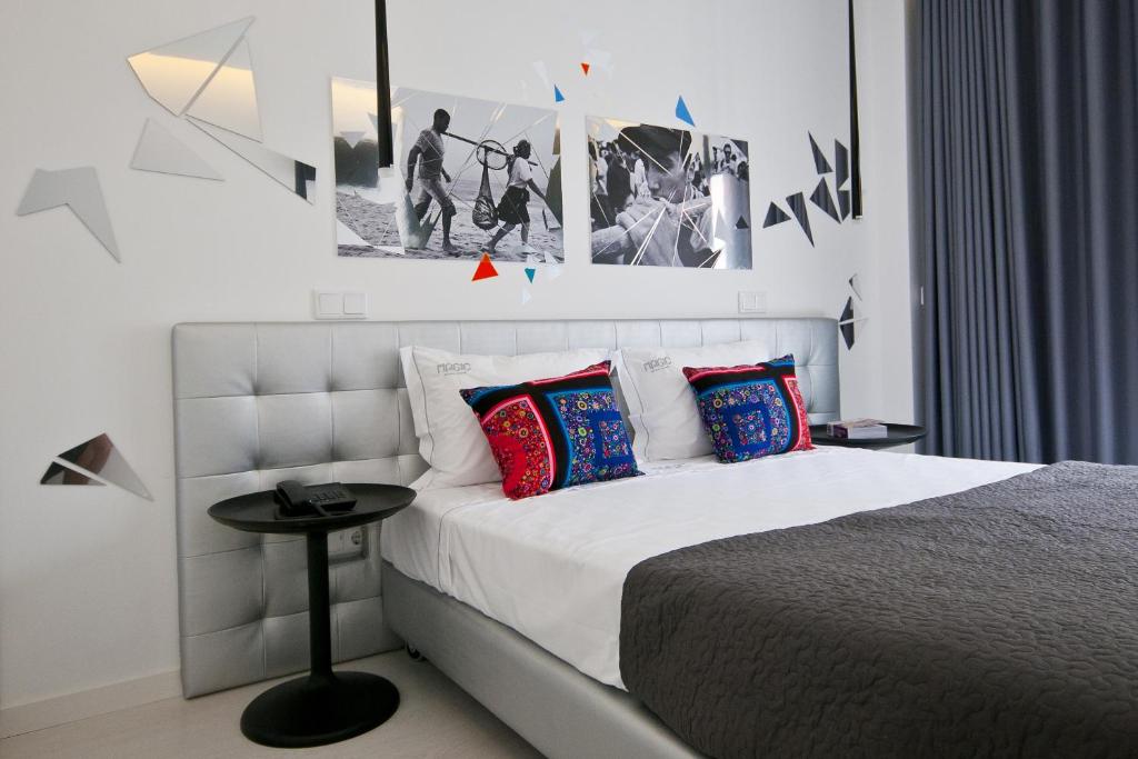 Postel nebo postele na pokoji v ubytování Hotel Magic