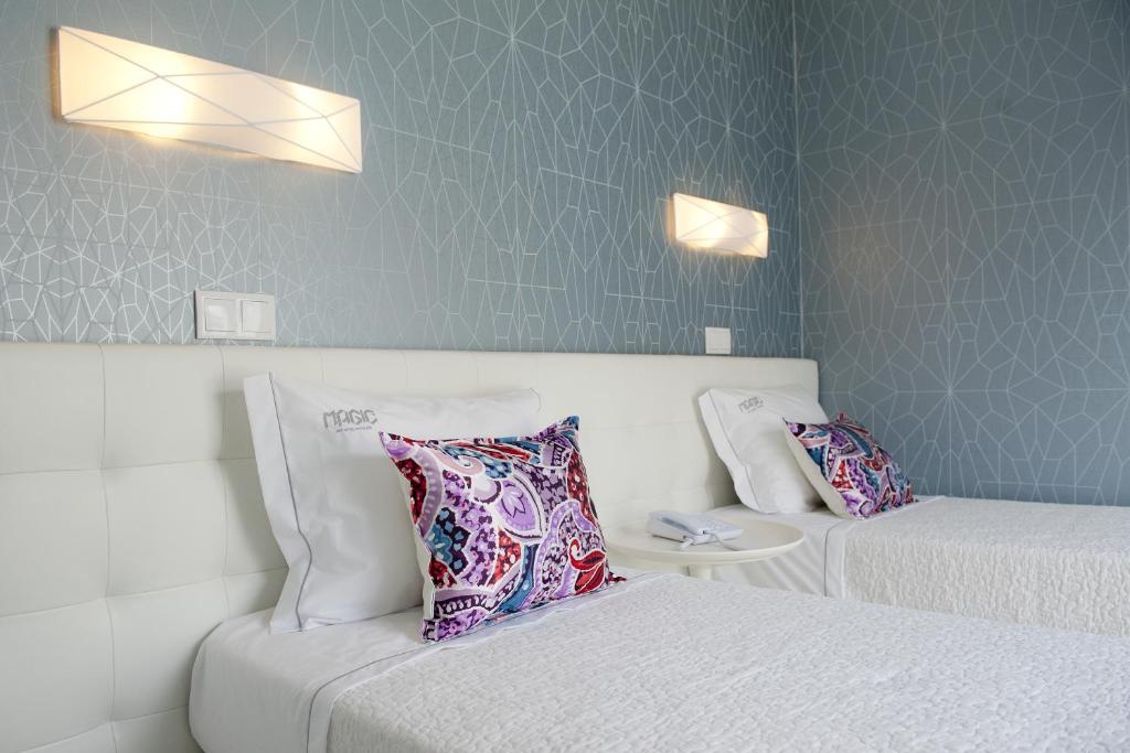 Postel nebo postele na pokoji v ubytování Hotel Magic