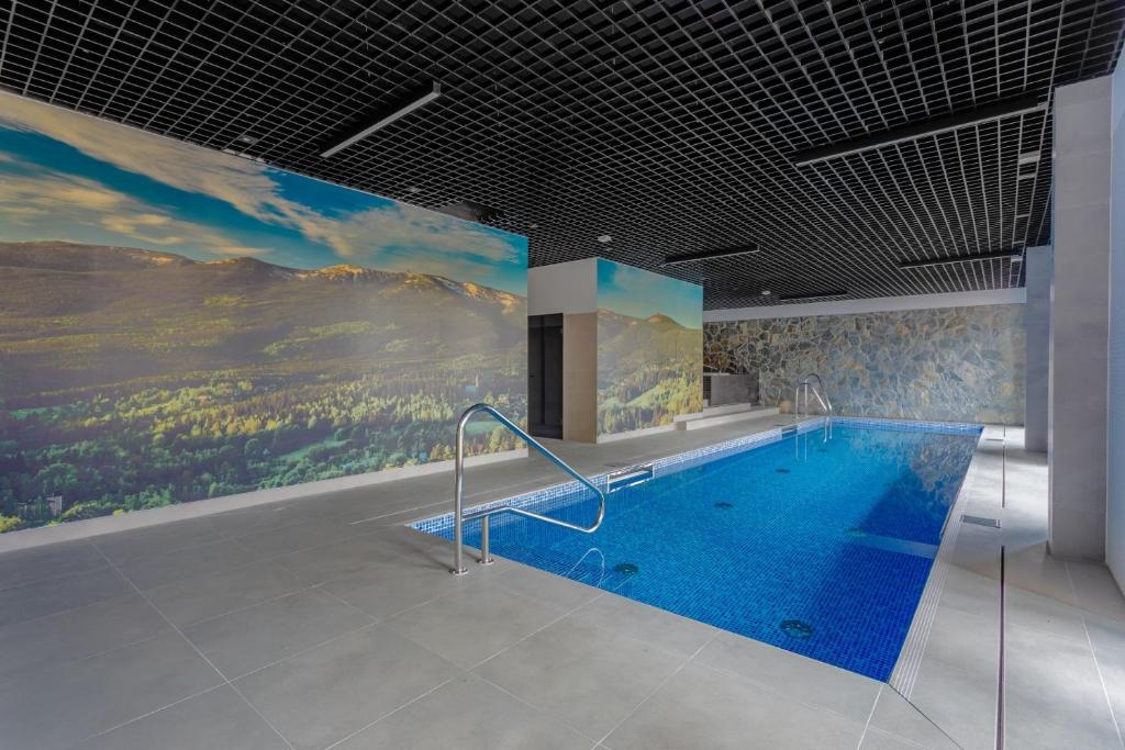 Bazén v ubytovaní Green Park Resort C15- z dostępem do basenu, sauny, jacuzzi, siłowni alebo v jeho blízkosti
