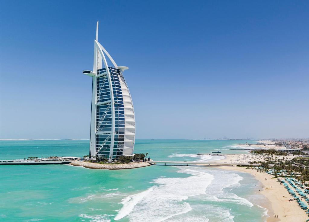 a view of the burj al arab hotel and the beach at Burj Al Arab Jumeirah in Dubai