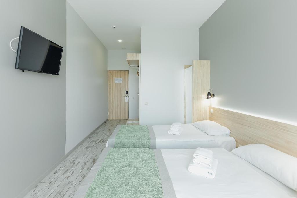 Postel nebo postele na pokoji v ubytování Hotel Vesna