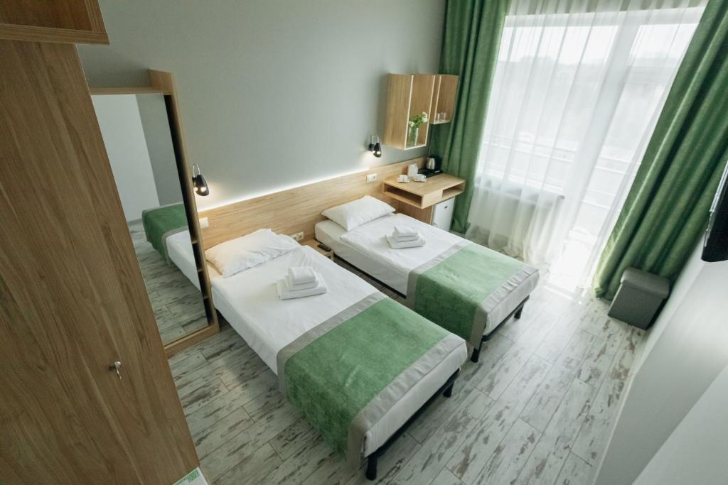 Postel nebo postele na pokoji v ubytování Hotel Vesna