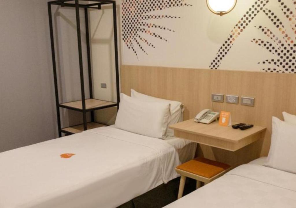 Postel nebo postele na pokoji v ubytování Go Hotels Plus Mandaluyong