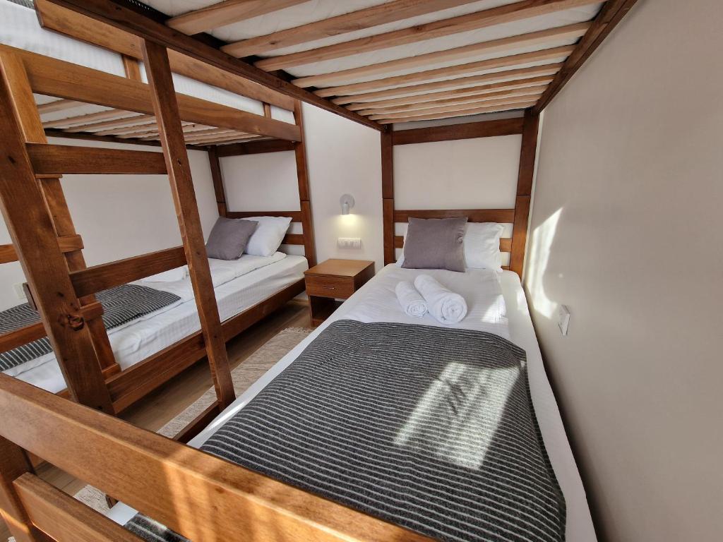 a bedroom with two bunk beds in a room at Vurk INN Paracin in Paraćin